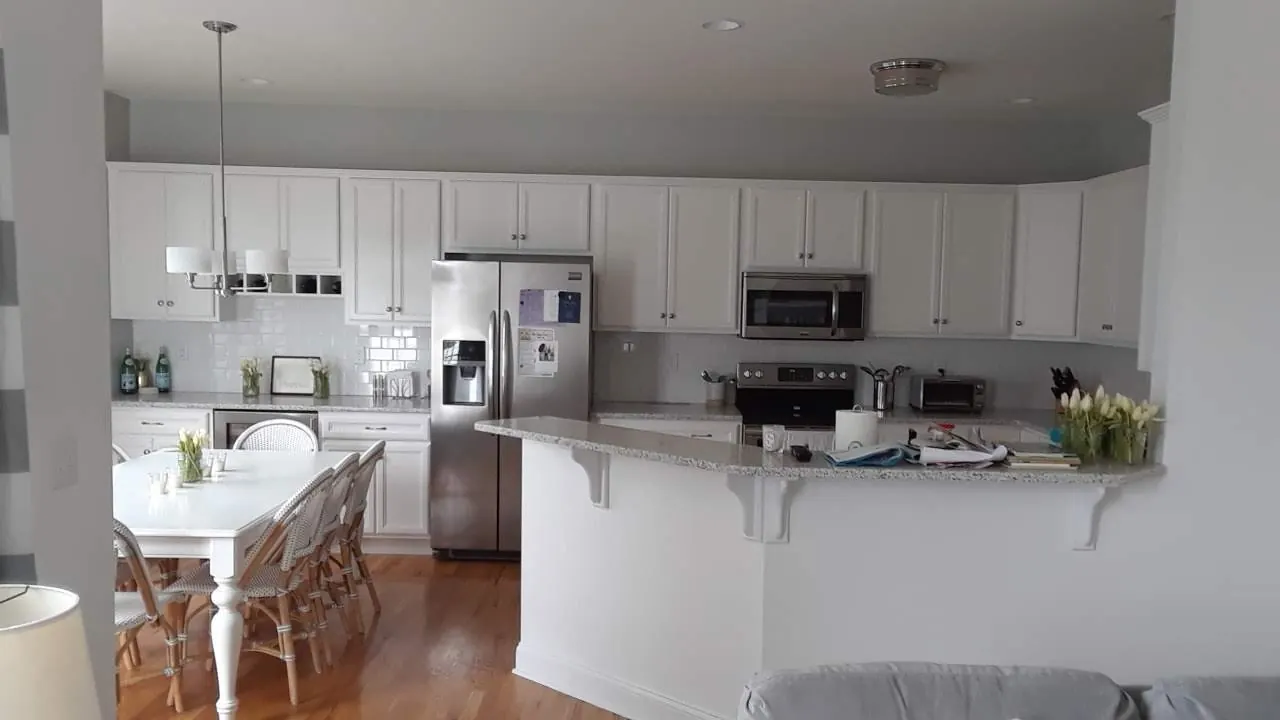 Bright white kitchen repaint by Old Coach Pro Painting