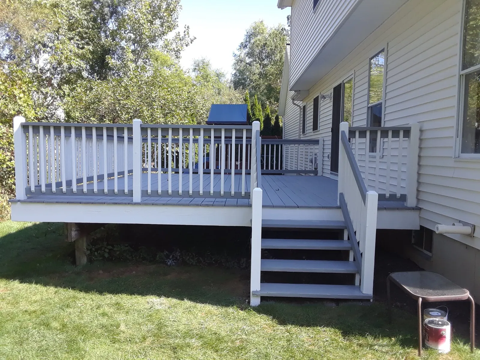 Deck with white rails and gray floor by Old Coach Pro Painting House Painter & Painting Contractor